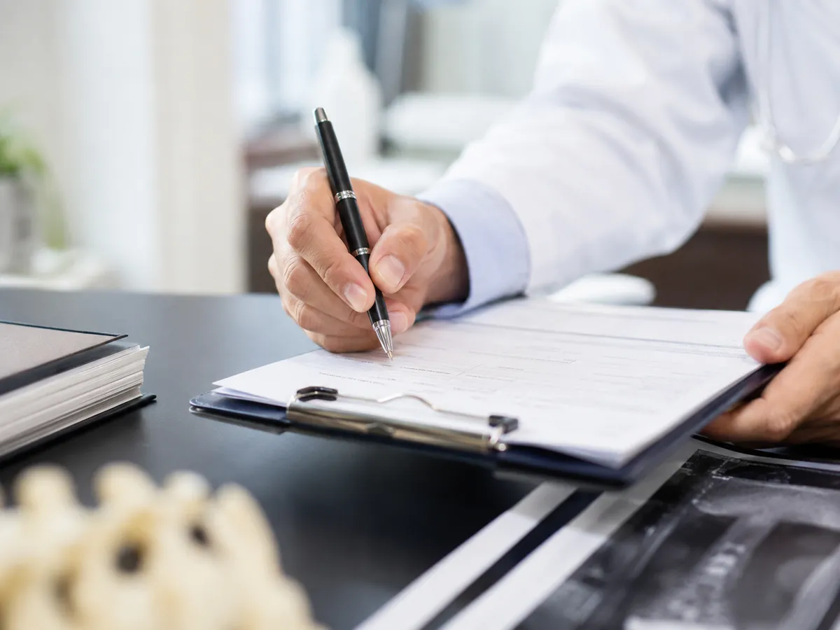 Clinician documenting an evaluation after a car accident